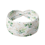 A Springtime in Brooklyn headband, featuring a white headband with green leaf pattern, versatile 3-in-1 twist style, and ultra-stretchy poly-knit blend.