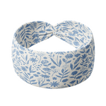 Olivia Floral on Ivory headband with a knot and blue floral pattern. Versatile 3-in-1 twist style, sweat absorbent, non-slip, machine washable. Designed for confidence and function.