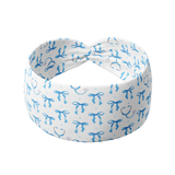 Nurses Do It white headband featuring blue bows and blue stethoscopes crafted from a buttery-soft, ultra-stretchy poly-knit blend, the most comfortable hair accessory ever.
