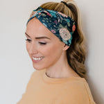 Adult women's black headband with hand-drawn gold, teal and coral roses with green stems and leaves