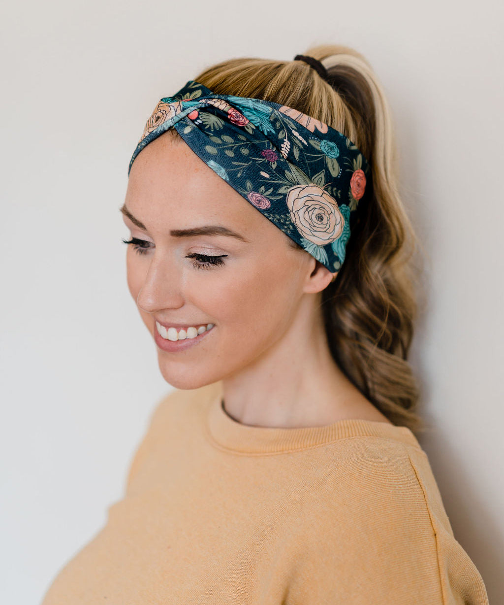 A woman wearing the Jen Floral on Black headband with happy confidence, showcasing the Black Pack of 5 top-selling headbands.