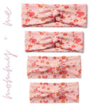A group of pink twist knot headbands for you and your mini me, featuring Mickey Mouse ears and flower design, with adjustable fit for toddlers and babies.