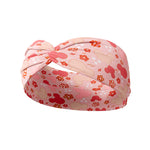 A pink headband with Mickey Mouse shapes and flowers, perfect for your best workout, your longest shift, or your cutest play day.