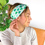 A woman wearing a In My Lucky Era Headband, showcasing its functional and versatile design for confidence in any activity.