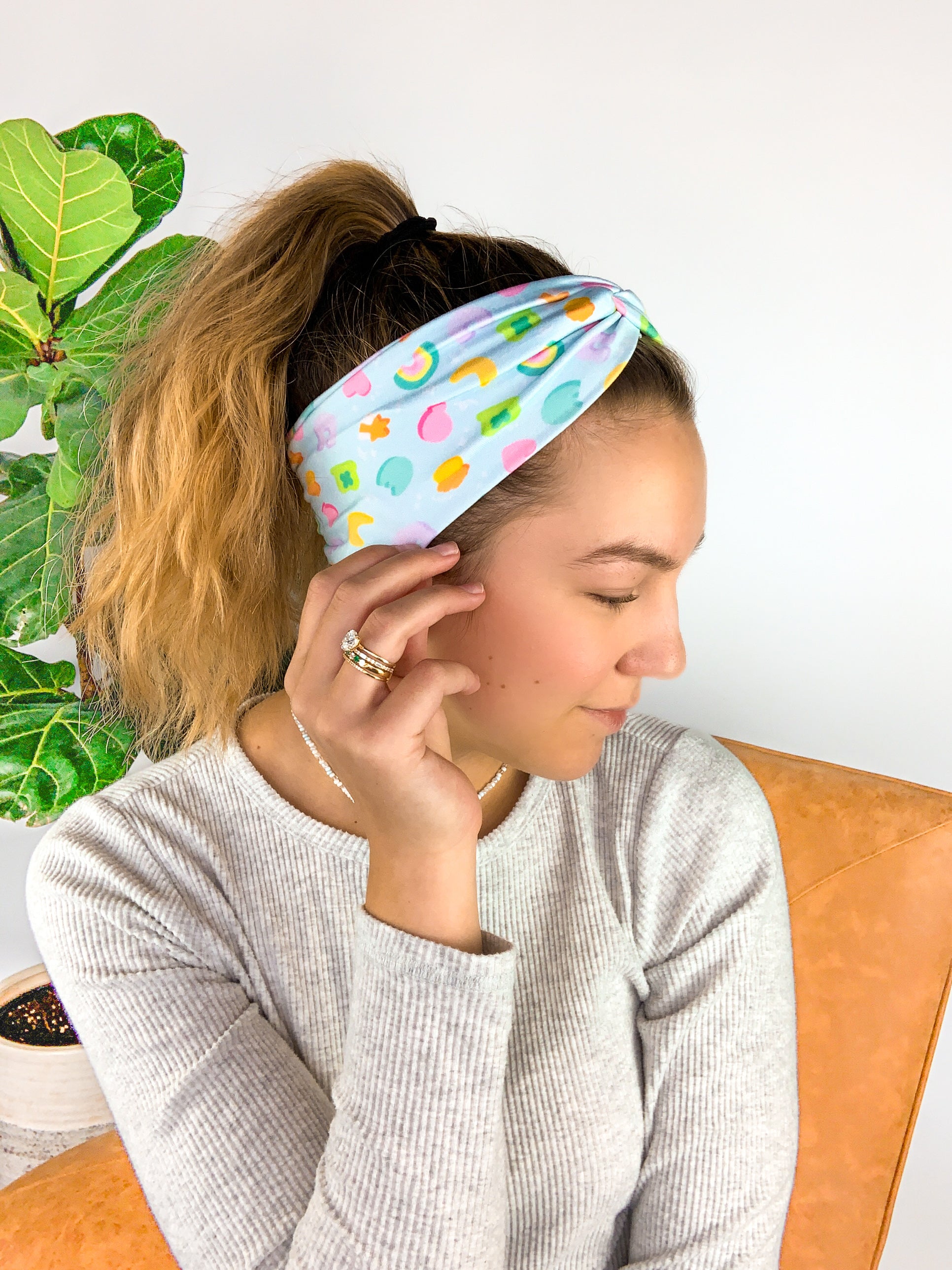 Adult women's soft teal headband with allover marshmallow cereal print