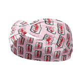 A pink headband with white flowers and a Diet Coke and pink ribbon print, designed for confidence and function. Features include one size fits most, machine washable, ultra stretchy poly-knit blend, 3-in-1 twist style, sweat absorbent, and non-slip.