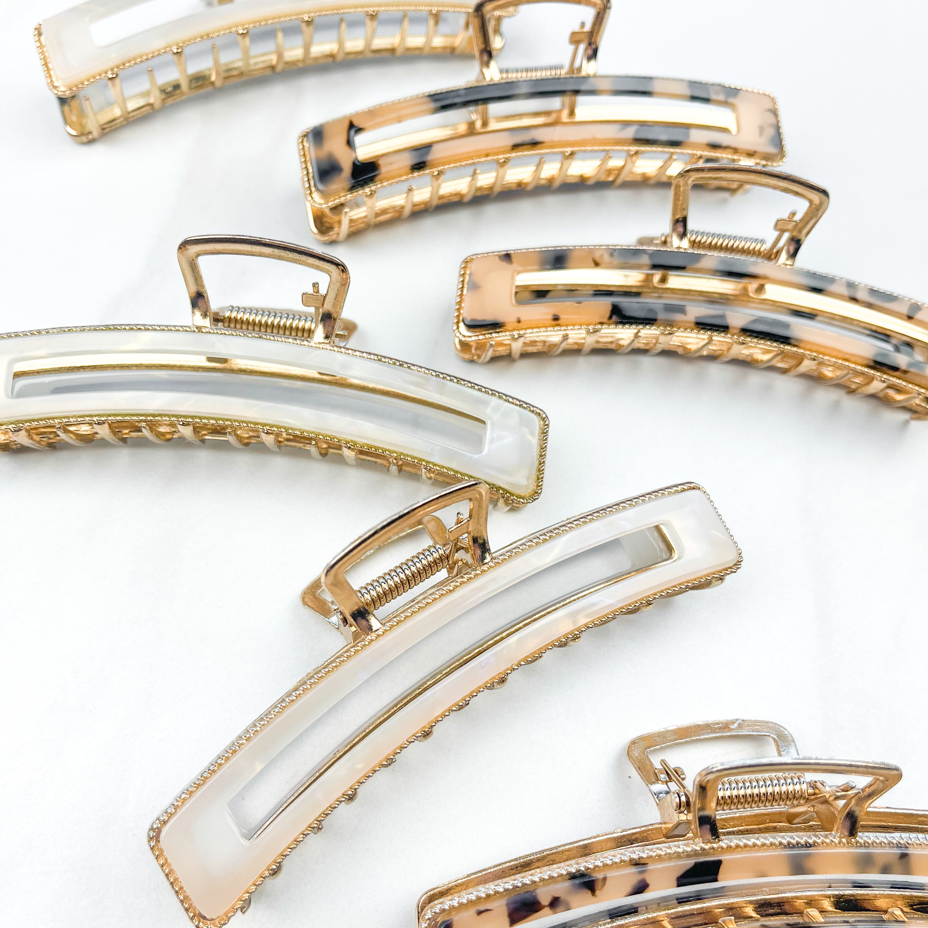 Fly Away Lilac Clip, a 4.5-inch glossy metal claw clip with hinge closure, shown among similar fashion accessories for versatile styling.