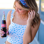 Adult women's navy headband with red, white and blue firework and star design