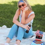 Adult women's navy headband with red, white and blue firework and star design