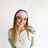 Woman with long hair wearing a Mia Floral on Ivory headband, showcasing its versatile 3-in-1 twist style and non-slip style perfect for workouts.