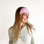 Woman with long hair wearing a Mia Floral on Ivory headband, showcasing its versatile 3-in-1 twist style and non-slip style perfect for workouts.