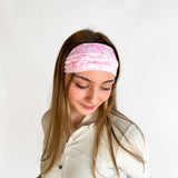 Woman with long hair wearing a Mia Floral on Ivory headband, showcasing its versatile 3-in-1 twist style and non-slip style perfect for workouts.