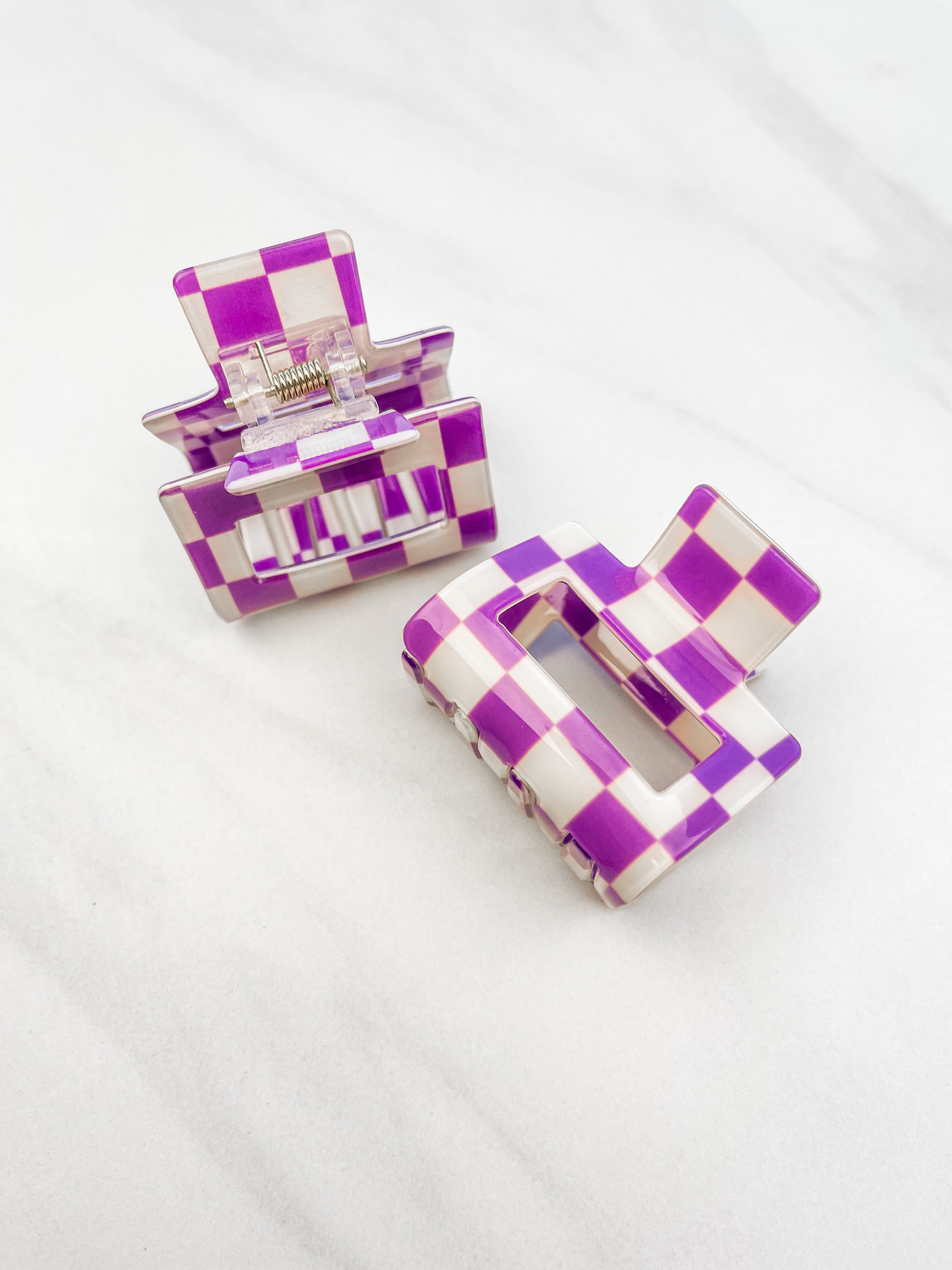 Checking In Lilac Clip: a 2-inch glossy purple checkered claw clip with a hinge closure, perfect for styling and keeping hair in place.