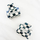 Checking In Lilac Clip: a 2-inch glossy black checkered claw clip with a hinge closure, perfect for styling and keeping hair in place.