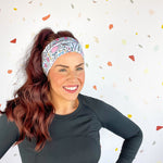 A woman confidently wears Lilac Market's Certified Flexpert headband. Functional and stylish, machine washable, ultra-soft poly-knit blend, sweat-absorbent, non-slip, versatile 3-in-1 twist style. Designed in Springfield, MO.