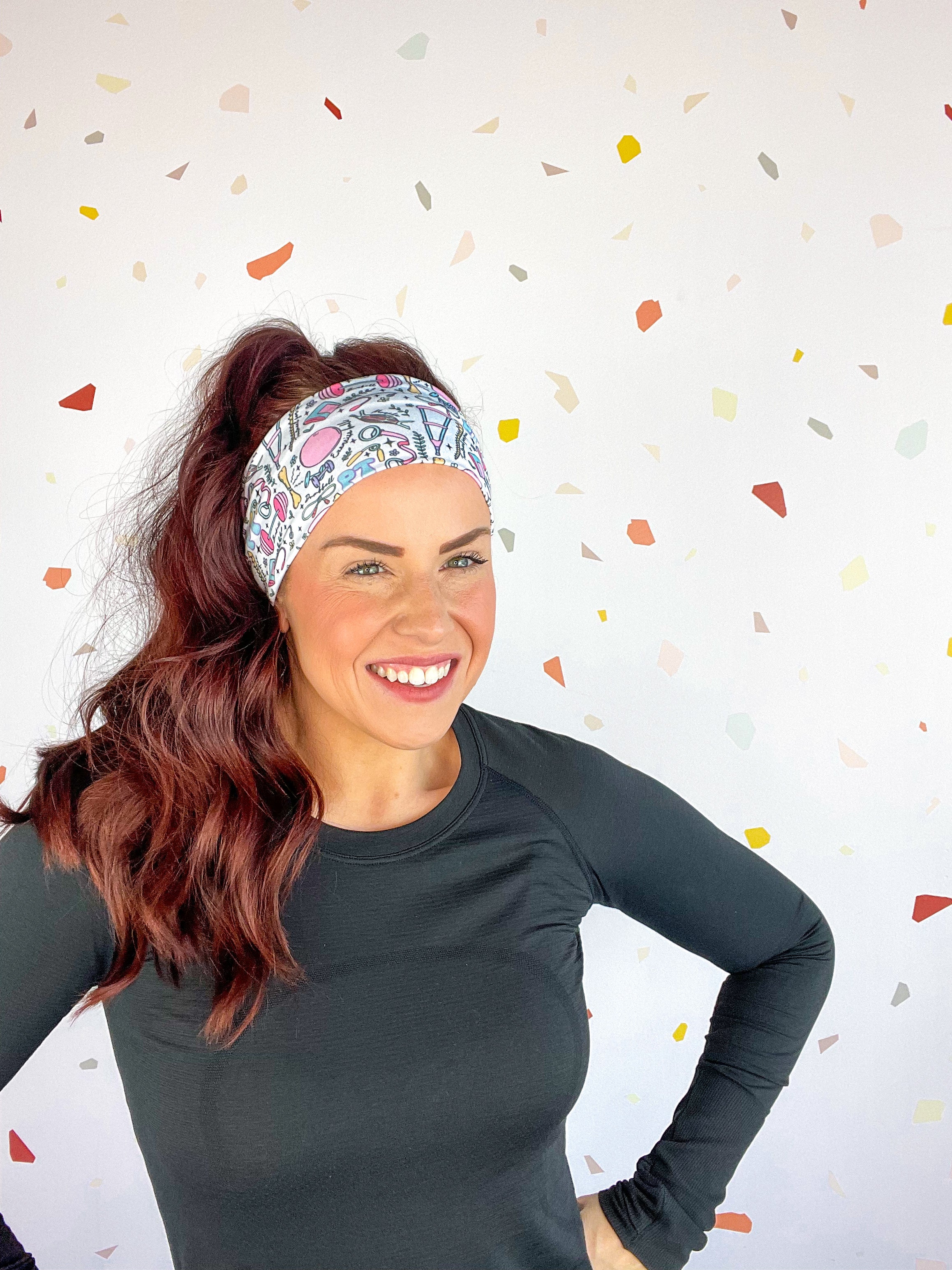 A woman confidently wears Lilac Market's Certified Flexpert headband. Functional and stylish, machine washable, ultra-soft poly-knit blend, sweat-absorbent, non-slip, versatile 3-in-1 twist style. Designed in Springfield, MO.