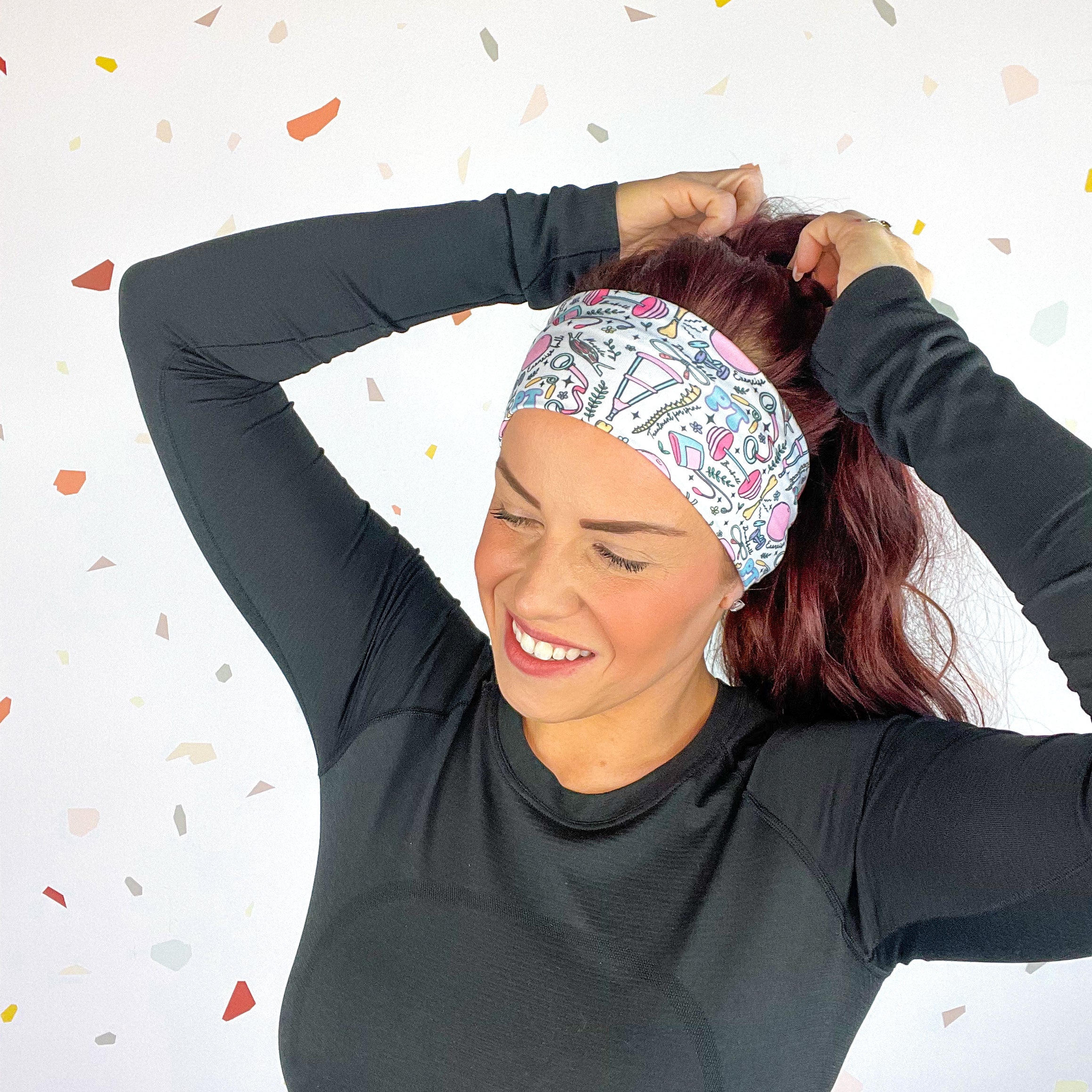 A woman confidently wears Lilac Market's Certified Flexpert headband. Functional and stylish, machine washable, ultra-soft poly-knit blend, sweat-absorbent, non-slip, versatile 3-in-1 twist style. Designed in Springfield, MO.