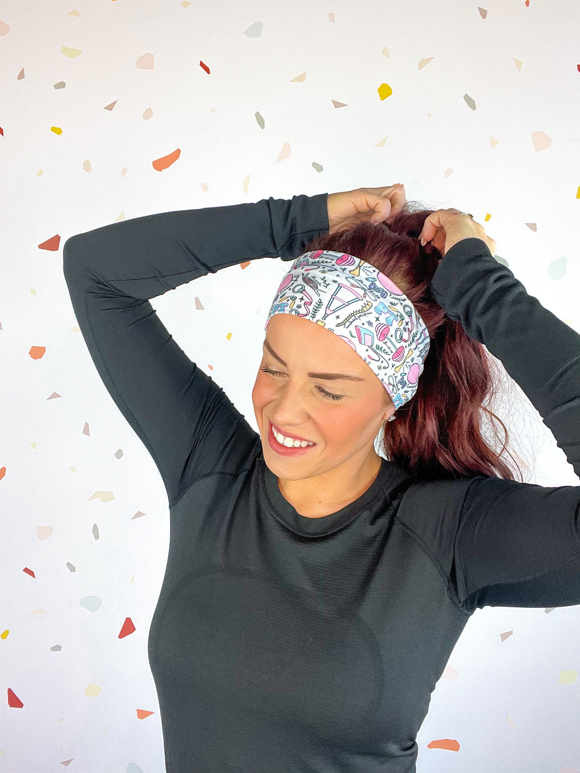 A woman confidently wears Lilac Market's Certified Flexpert headband. Functional and stylish, machine washable, ultra-soft poly-knit blend, sweat-absorbent, non-slip, versatile 3-in-1 twist style. Designed in Springfield, MO.