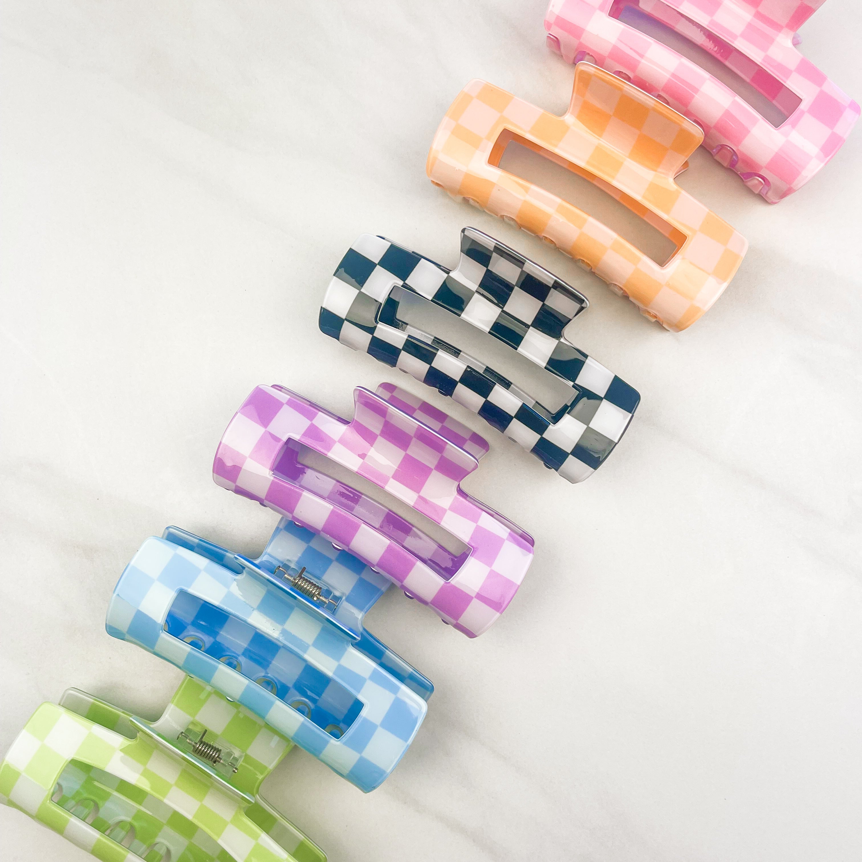 Checkmate Lilac Clip: a 3.6-inch glossy checkered claw clip with a hinge closure, perfect for styling and keeping hair in place.