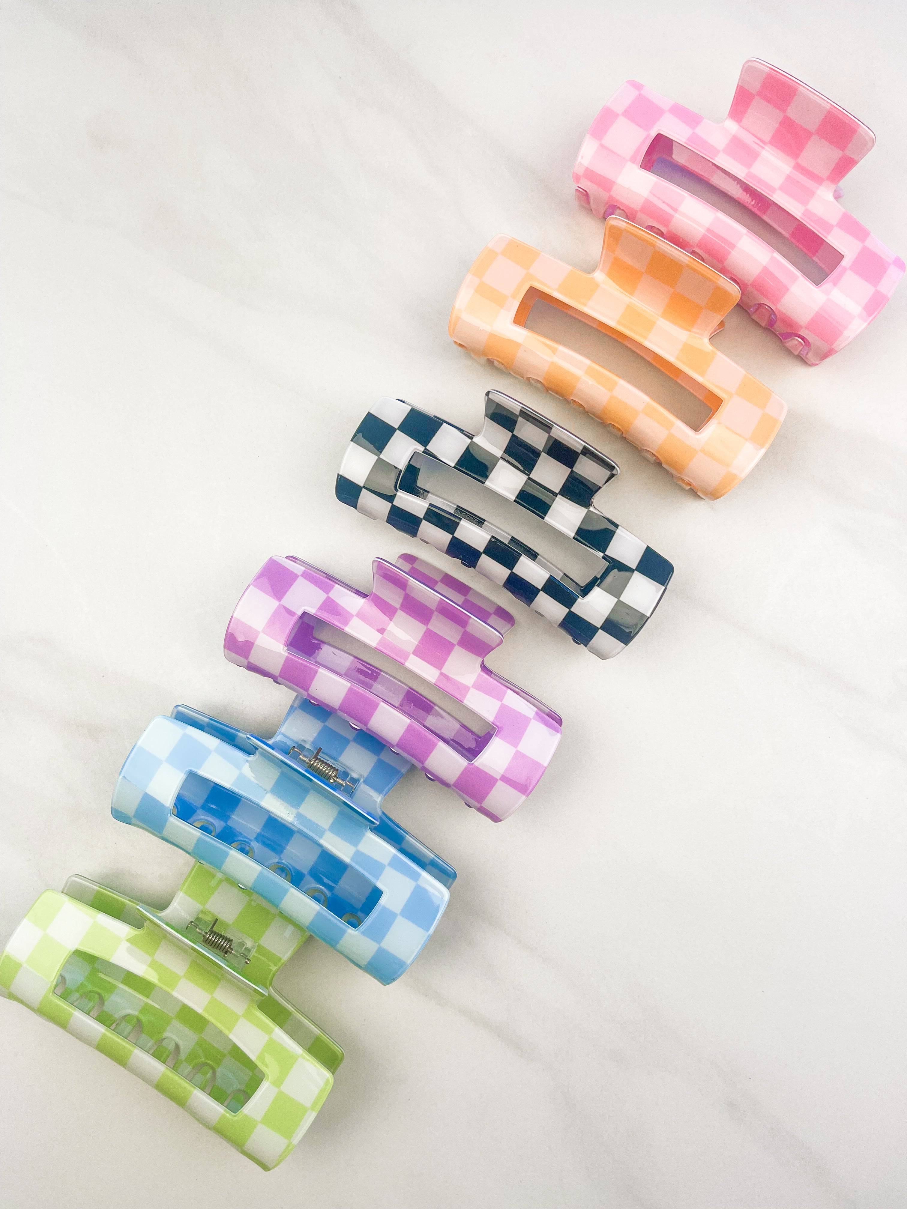 Checkmate Lilac Clip: a 3.6-inch glossy checkered claw clip with a hinge closure, perfect for styling and keeping hair in place.