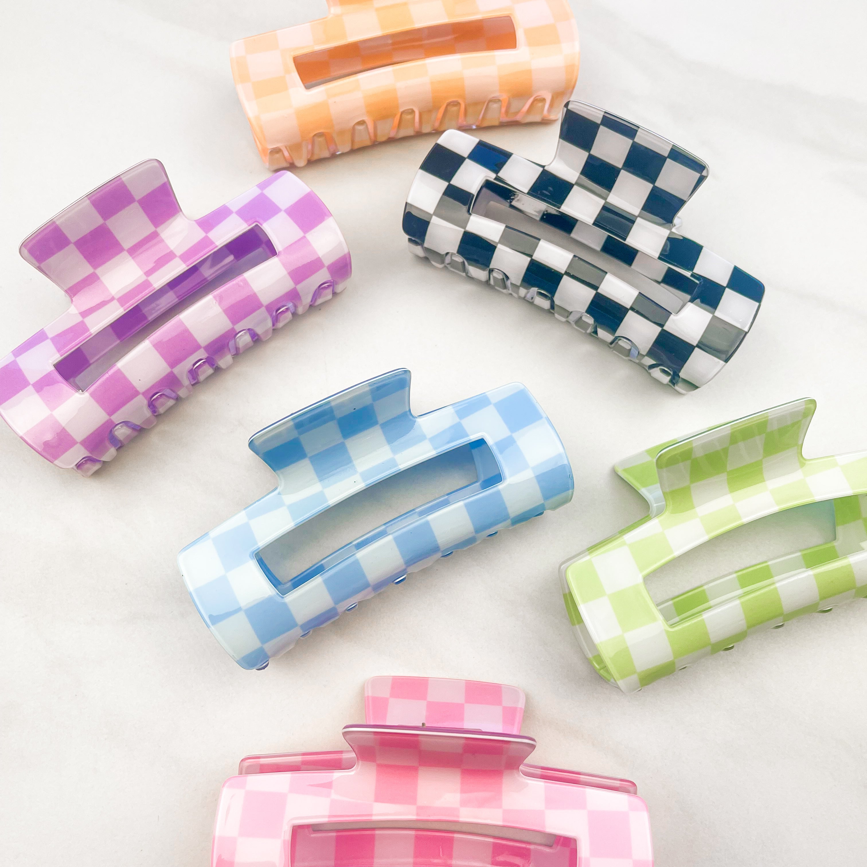 Checkmate Lilac Clip: a 3.6-inch glossy checkered claw clip with a hinge closure, perfect for styling and keeping hair in place.