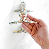 Hair claw clip in marbled white, clear, pink, multi or tortoise in a loop shape