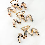 Effortless Lilac Clip, a group of hair clips with a gold, tan and black zig-zag design, perfect for all hair types and textures.