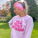 Adult women's acid wash watercolor in hot pink, orange, blue and yellow with the white 70's bubble font saying "Mother Runner".