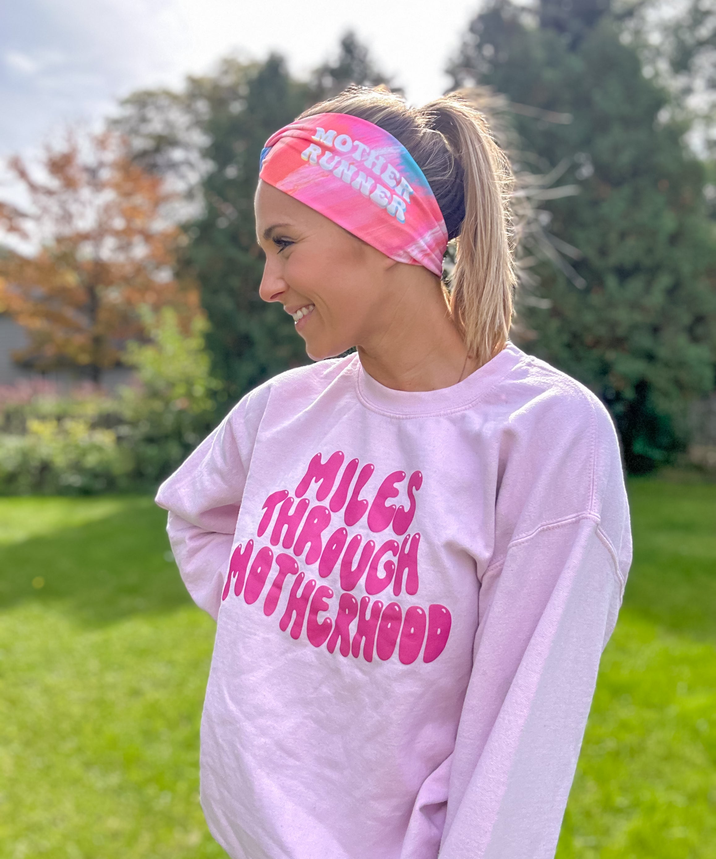 Adult women's acid wash watercolor in hot pink, orange, blue and yellow with the white 70's bubble font saying "Mother Runner".