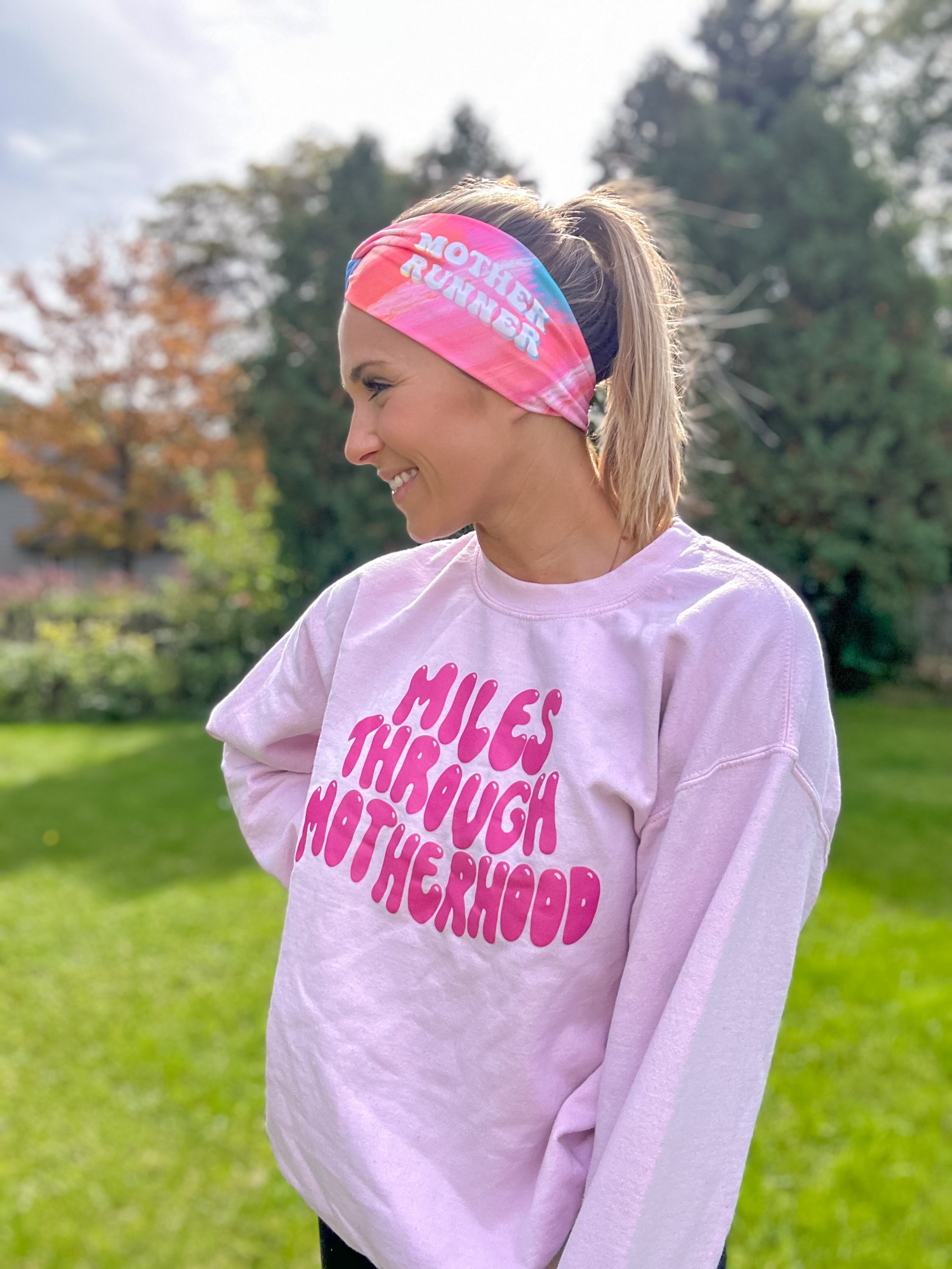 Adult women's acid wash watercolor in hot pink, orange, blue and yellow with the white 70's bubble font saying "Mother Runner".