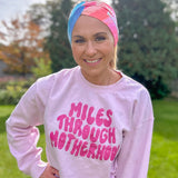 Adult women's acid wash watercolor in hot pink, orange, blue and yellow with the white 70's bubble font saying "Mother Runner".