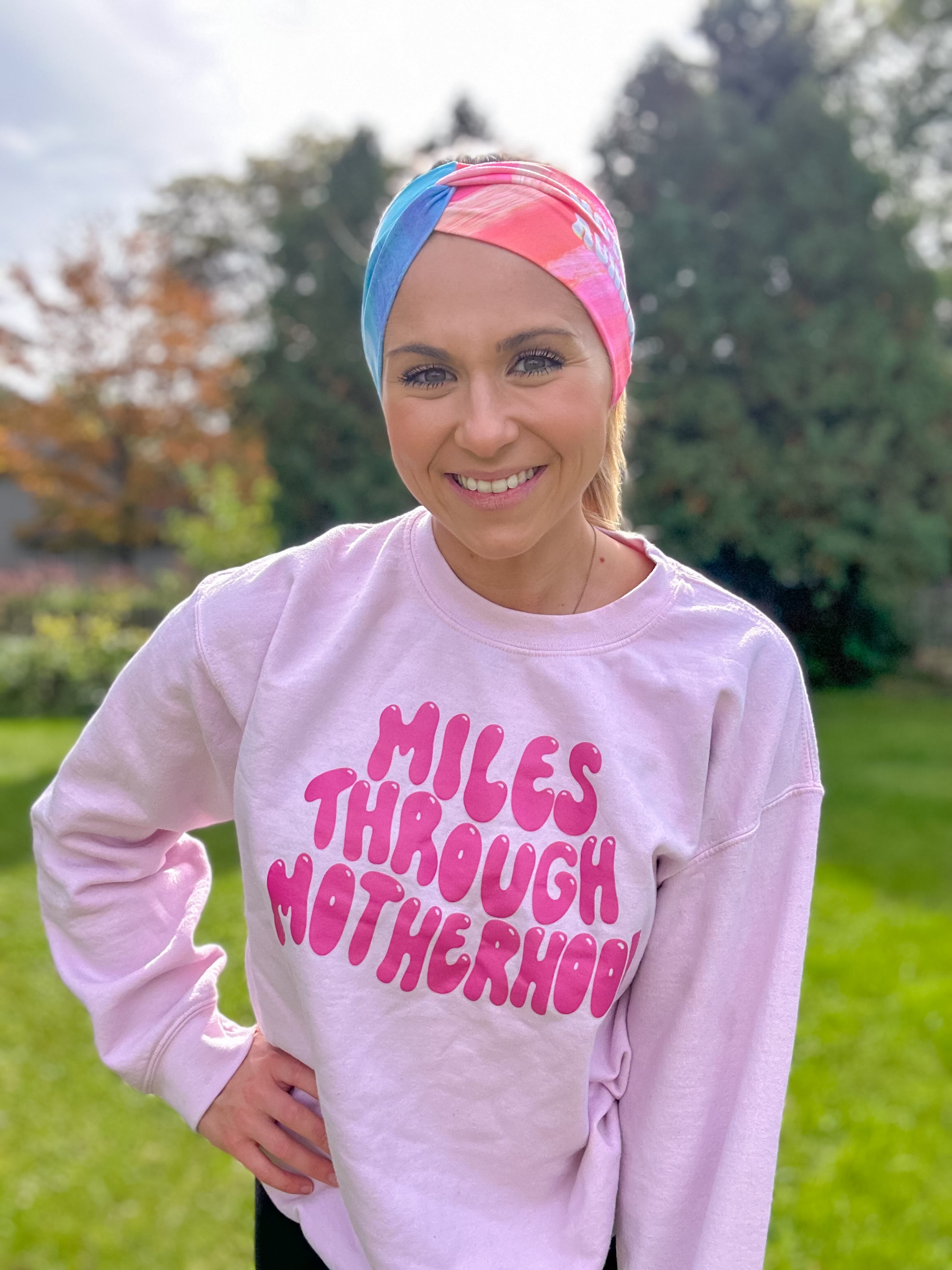 Adult women's acid wash watercolor in hot pink, orange, blue and yellow with the white 70's bubble font saying "Mother Runner".