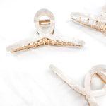 Hair claw clip in marbled white, clear, pink, multi or tortoise in a loop shape