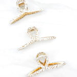 Hair claw clip in marbled white, clear, pink, multi or tortoise in a loop shape