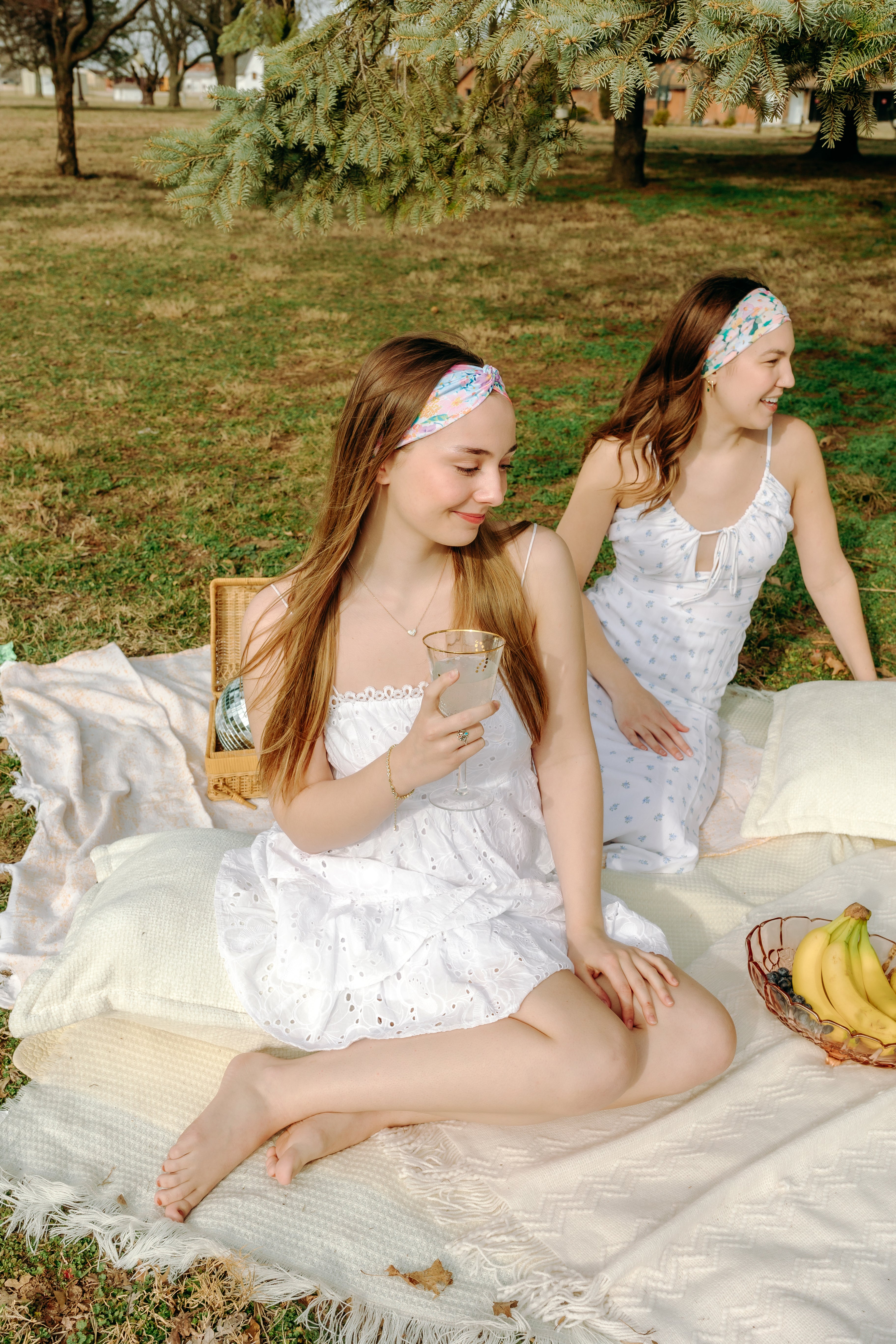Woman smiling while wearing the Erica Floral on Ivory headband, the perfect non-slip accessory for work or workouts.