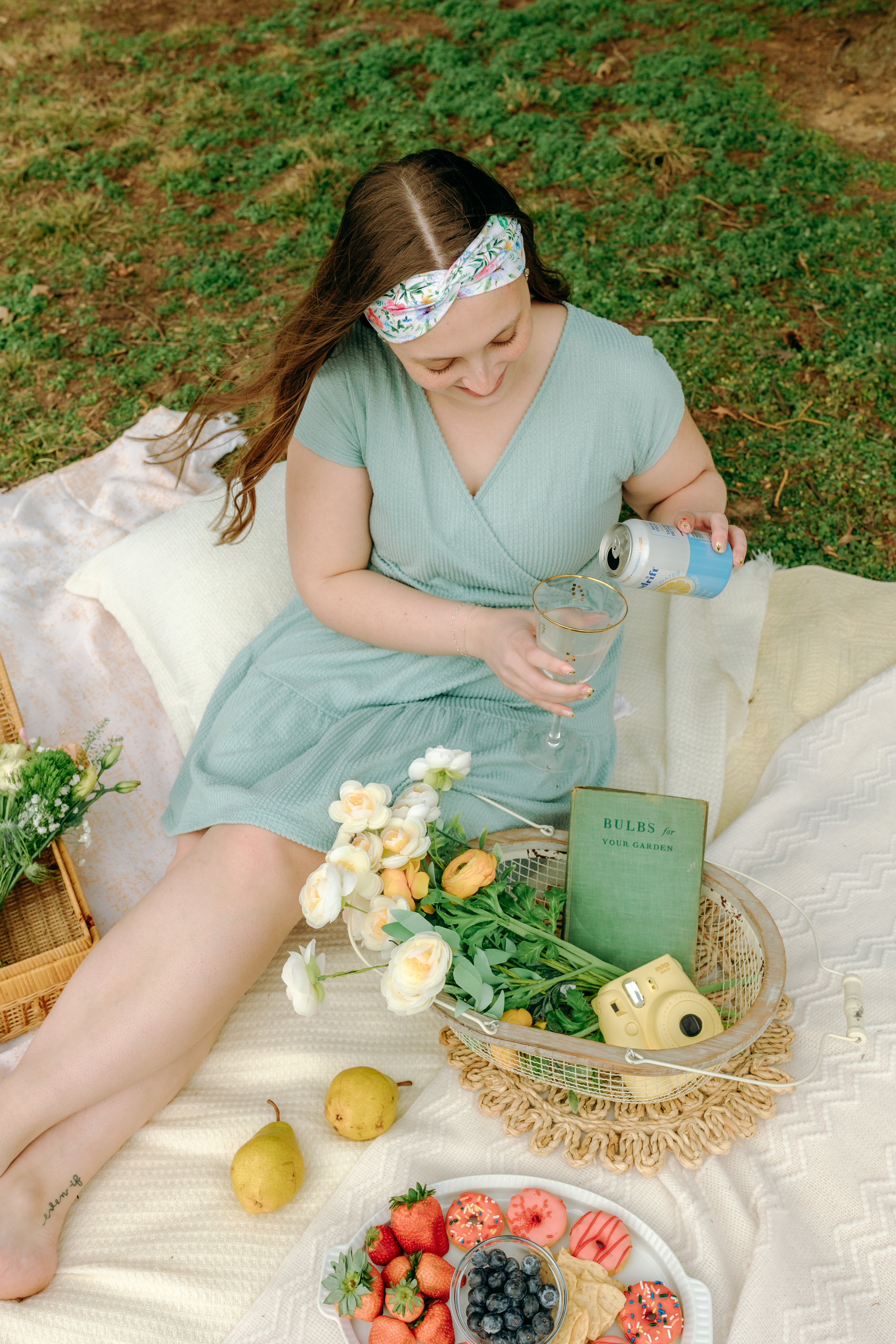 Woman smiling while wearing the Isabella Floral on Ivory headband, the perfect non-slip accessory for work or workouts.