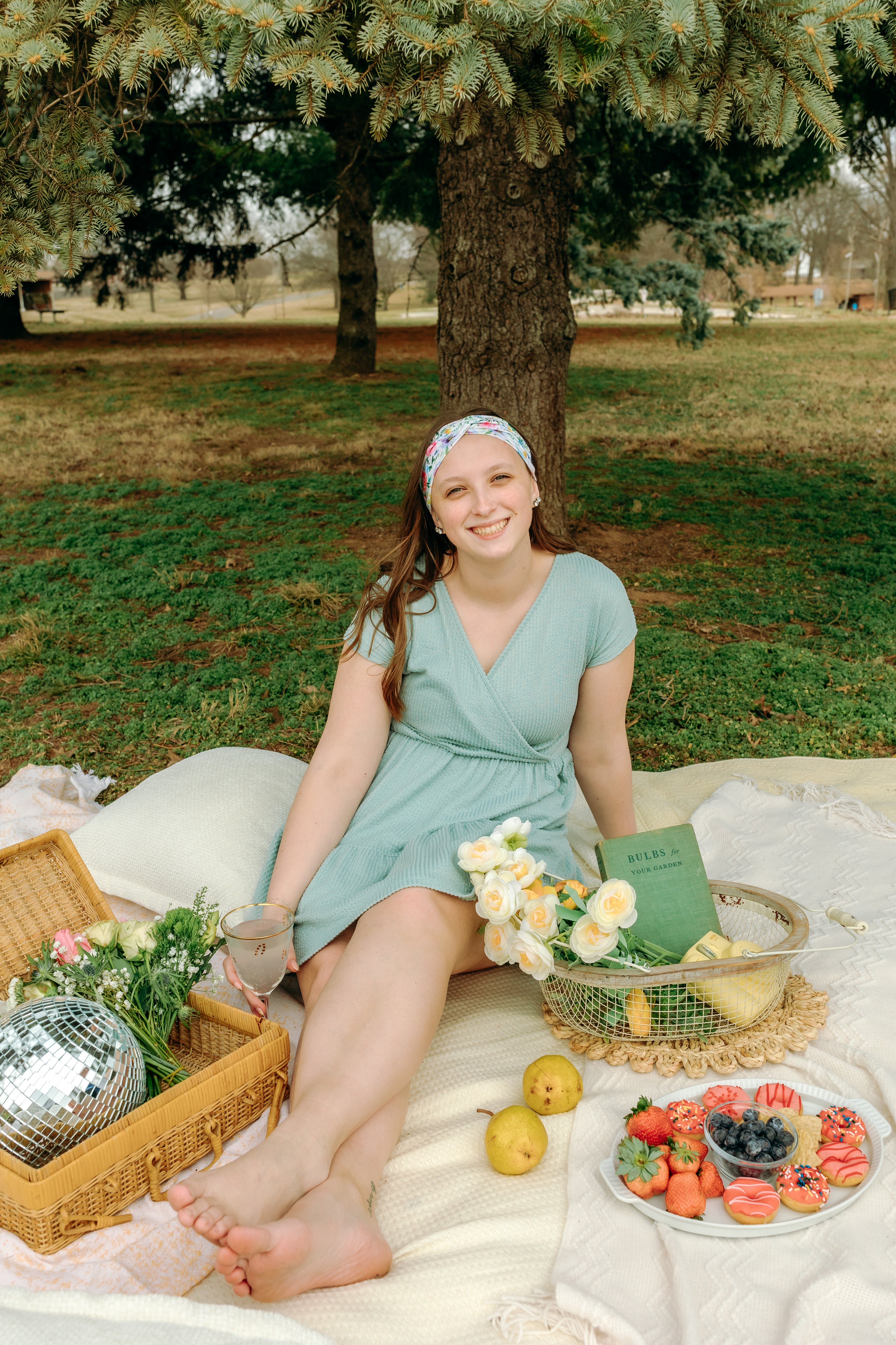 Woman smiling while wearing the Isabella Floral on Ivory headband, the perfect non-slip accessory for work or workouts.