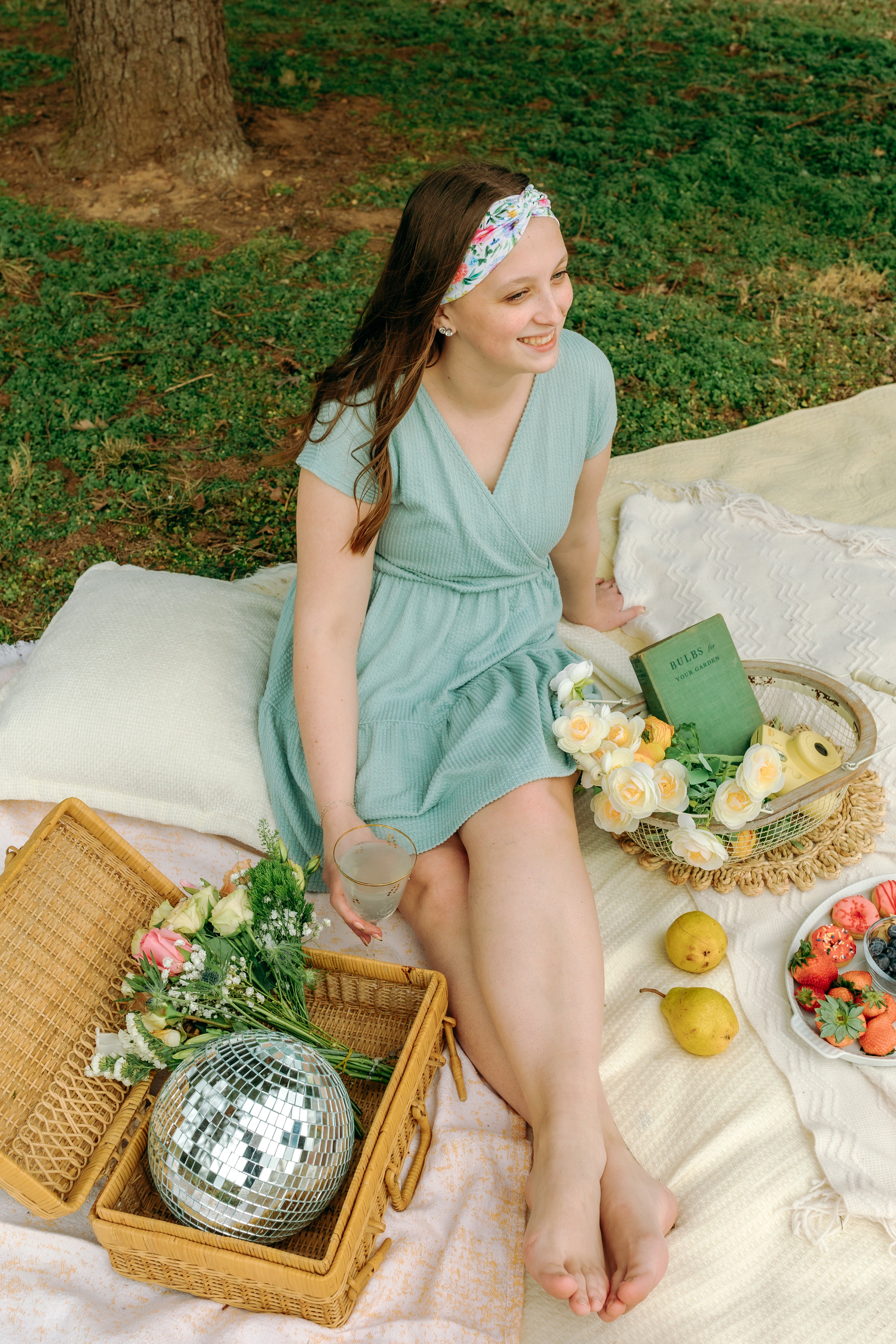 Woman smiling while wearing the Isabella Floral on Ivory headband, the perfect non-slip accessory for work or workouts.