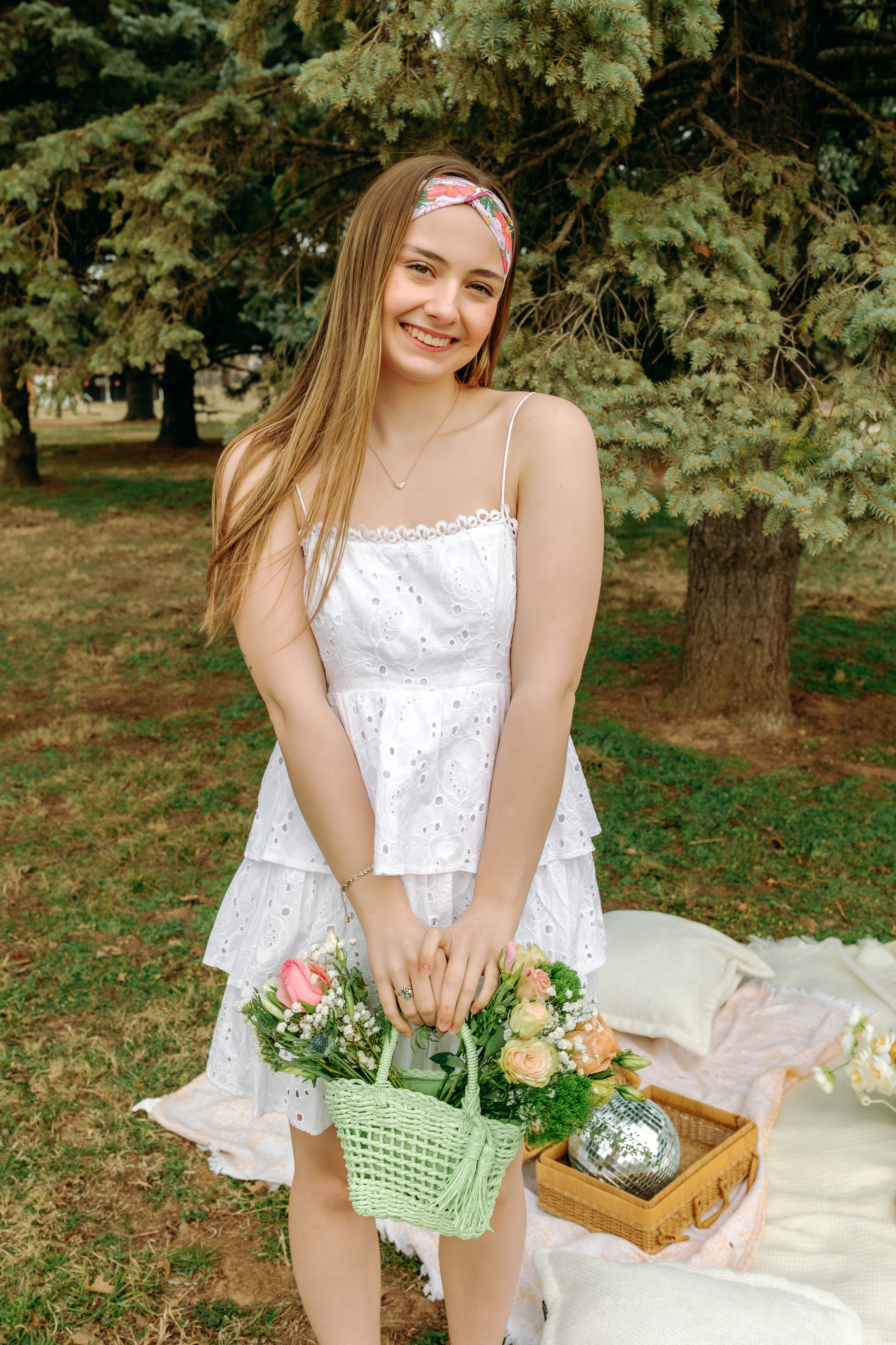 Woman smiling while wearing the Sydney Floral on Beige headband, the perfect non-slip accessory for work or workouts.