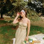 Woman with long hair confidently wearing the Willow Floral on Ivory headband, the perfect non-slip accessory for long shifts or play days.