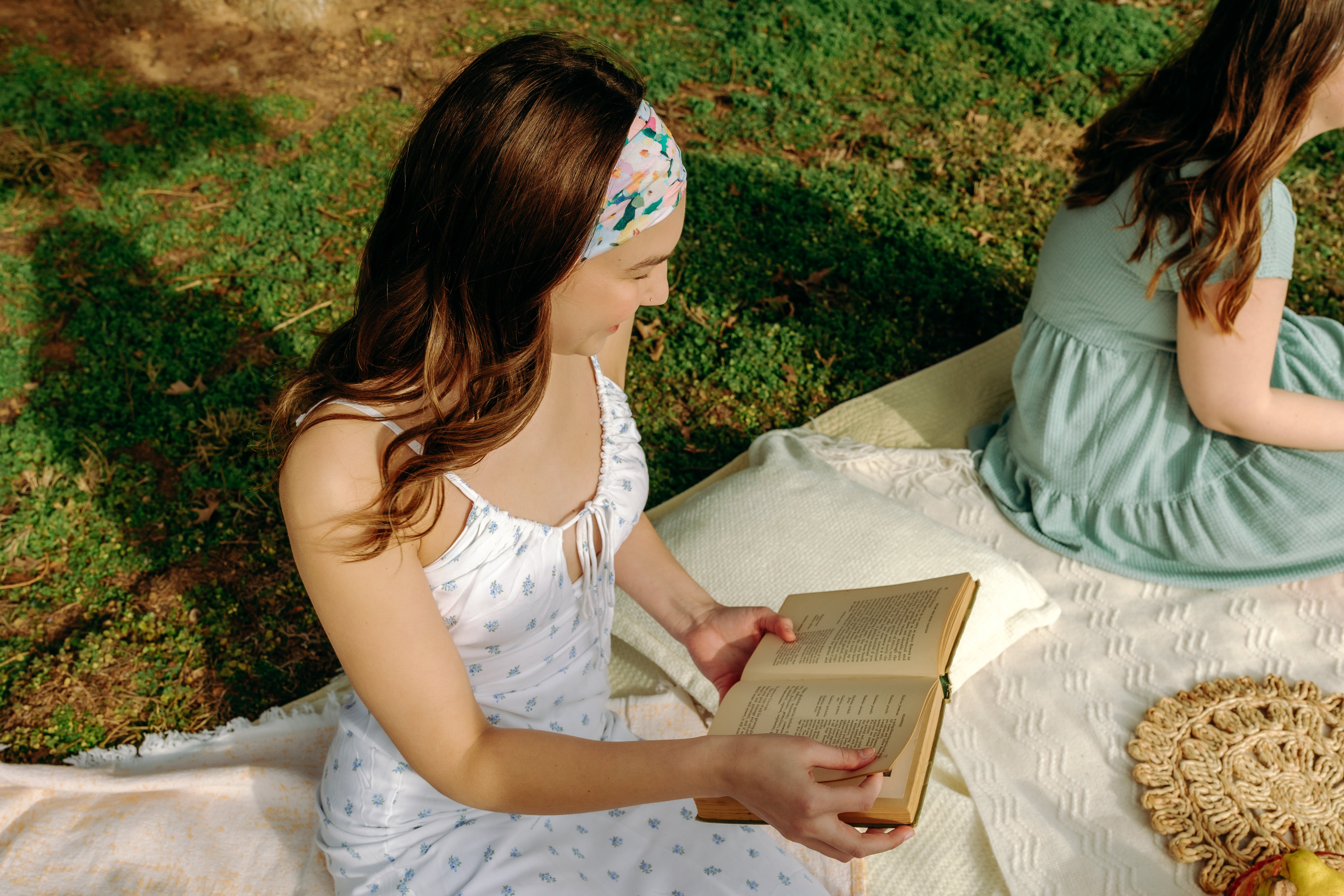 Woman with long hair confidently wearing the Tori Floral on Sage headband, the perfect non-slip accessory for long shifts or play days.