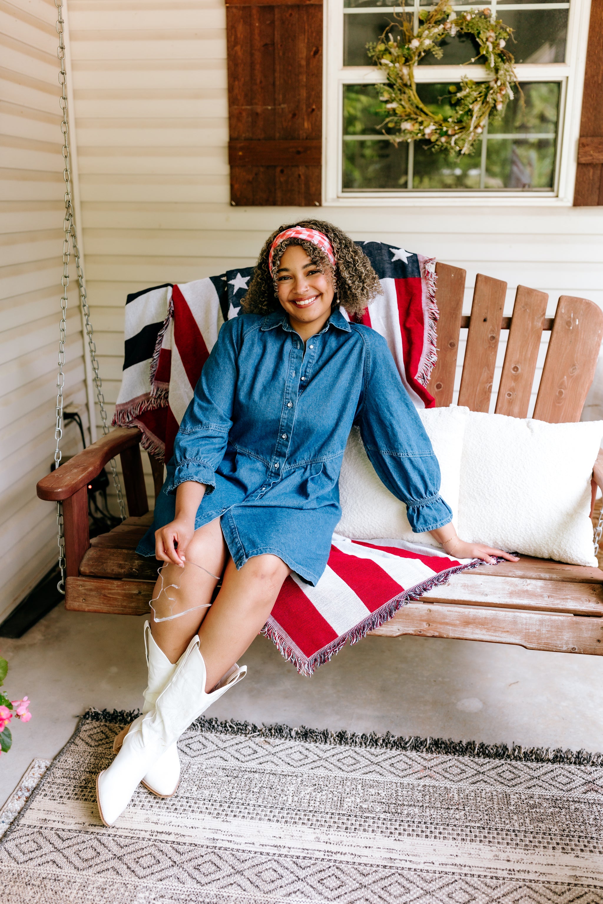 Woman with curly hair type happily wearing the most comfortable hand-made headband in the print More Picnics, Please!