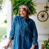 Woman with curly hair type happily wearing the most comfortable hand-made headband in the print You Look Like the Fourth of July.