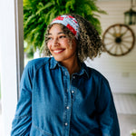 Woman with curly hair type happily wearing the most comfortable hand-made headband in the print You Look Like the Fourth of July.