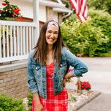 Woman with long straight hair type happily wearing the most comfortable hand-made headband in the print Life is Sweet.