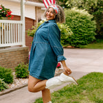 Woman with curly hair type happily wearing the most comfortable hand-made headband in the print You Look Like the Fourth of July.