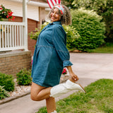 Woman with curly hair type happily wearing the most comfortable hand-made headband in the print You Look Like the Fourth of July.