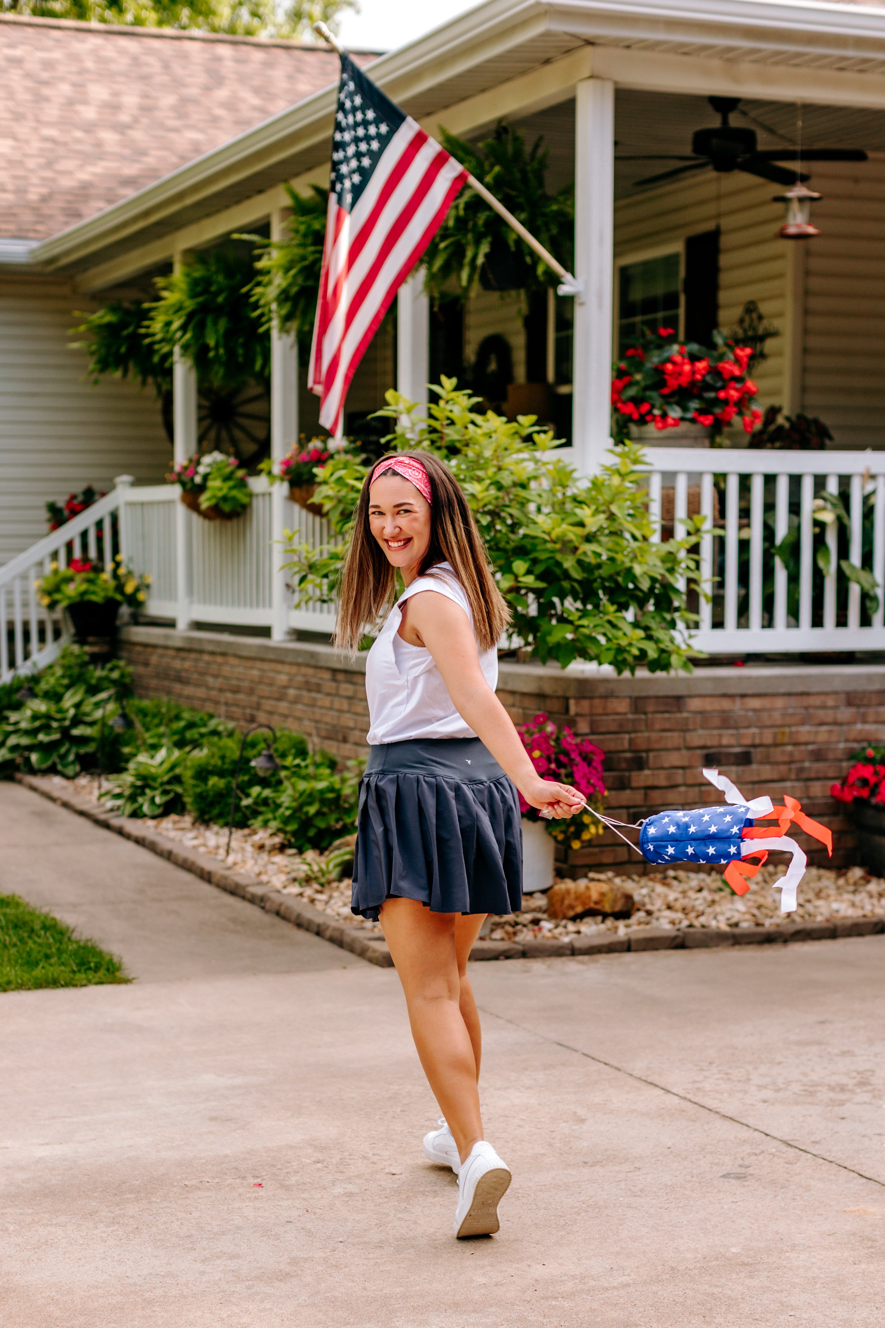 Woman with long straight hair type happily wearing the most comfortable hand-made headband in the print Summer Nights on Cherry.