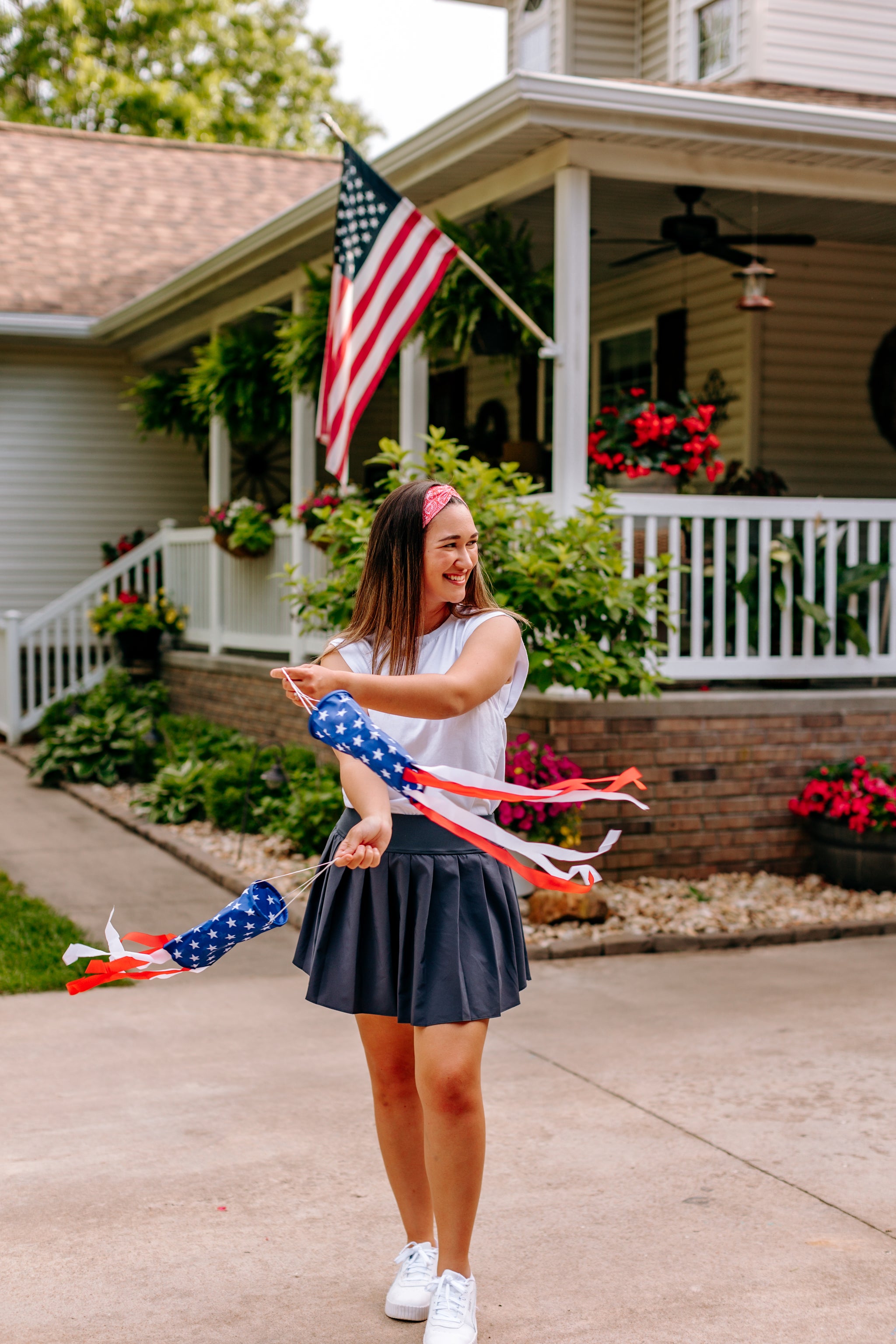 Woman with long straight hair type happily wearing the most comfortable hand-made headband in the print Summer Nights on Cherry.