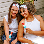 Women with different hair types happily wearing the most comfortable hand-made headband in the print Stay Cool. 